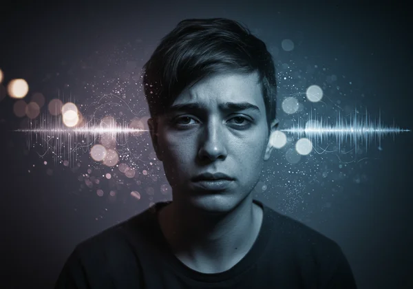 Person feeling overwhelmed by sensory input and exhaustion